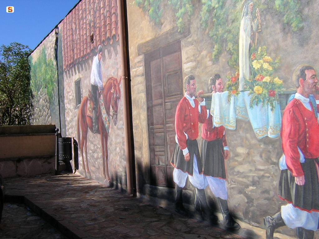 Cossoine, murale che rievoca la processione del Santo Patrono